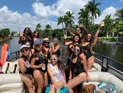 Group celebrating aboard the Breezy Tiki